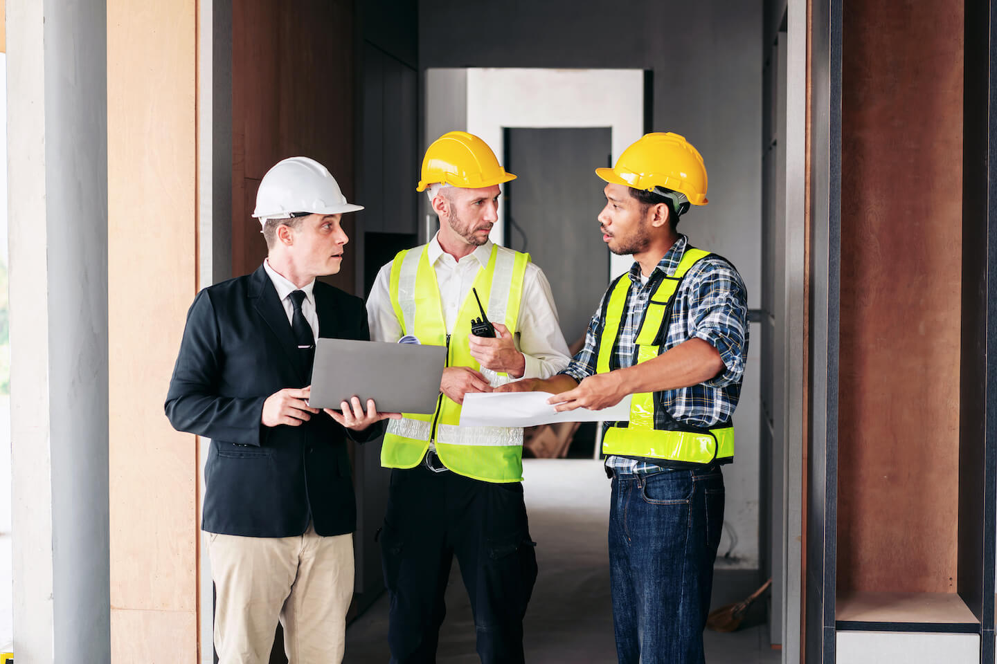 three men in construction gear are standing in fro 2024 10 15 02 25 17 utc.jpg